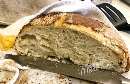 a slice of crusty, no-knead bread